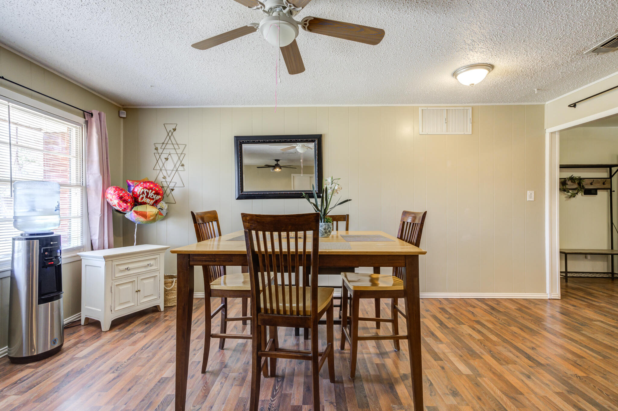 2812 62nd Street Lubbock, TX 79413 - Photo 19 of 45 a view of a dining room with furniture and wooden floor