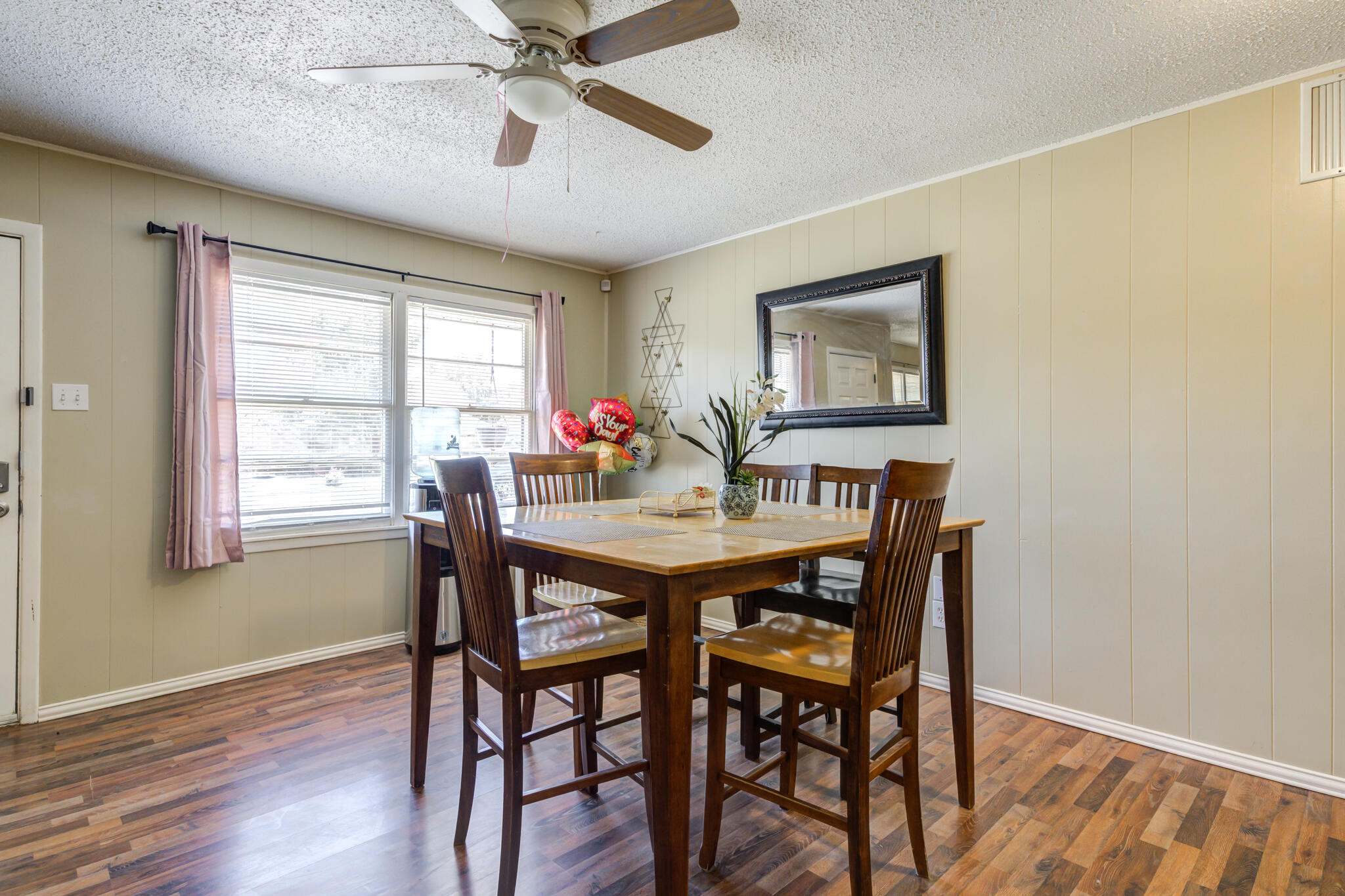 2812 62nd Street Lubbock, TX 79413 - Photo 21 of 45 a view of a dining room with furniture window and wooden floor