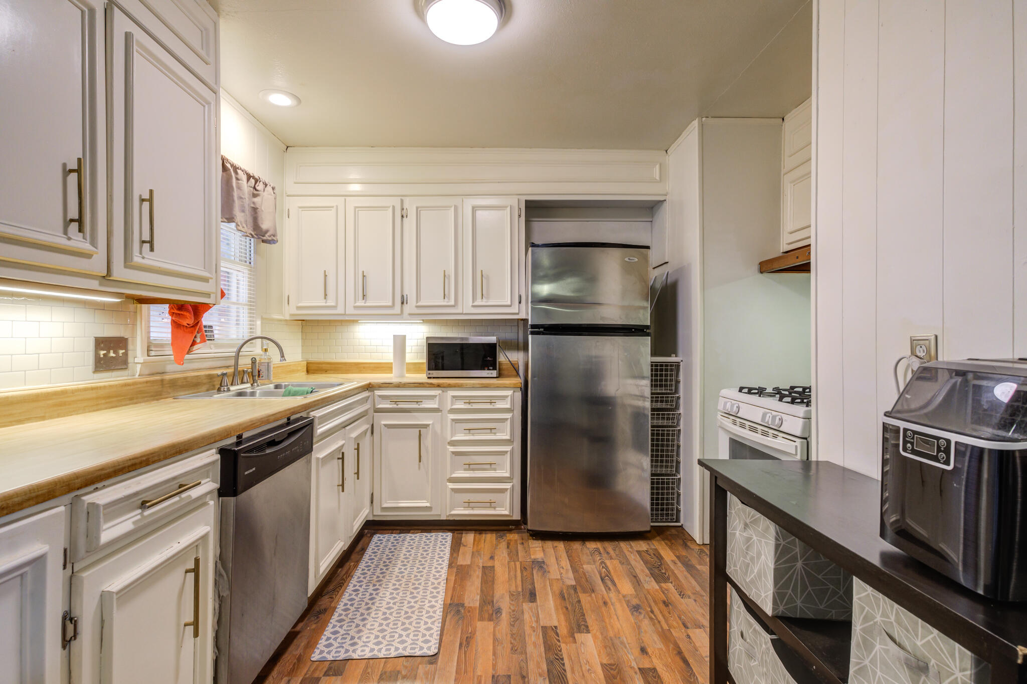 2812 62nd Street Lubbock, TX 79413 - Photo 29 of 45 a kitchen with a sink stove and refrigerator
