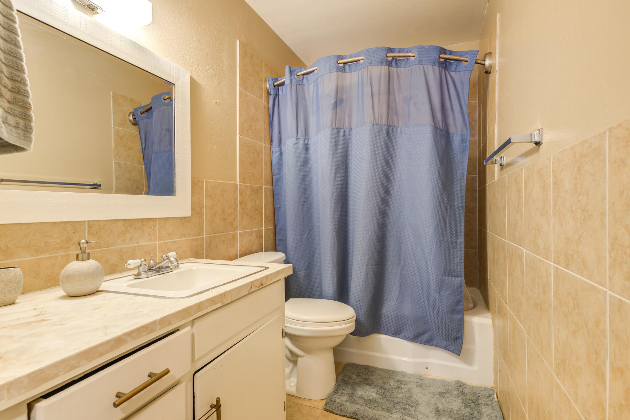 2812 62nd Street Lubbock, TX 79413 - Photo 34 of 45 a bathroom with a sink a toilet and shower