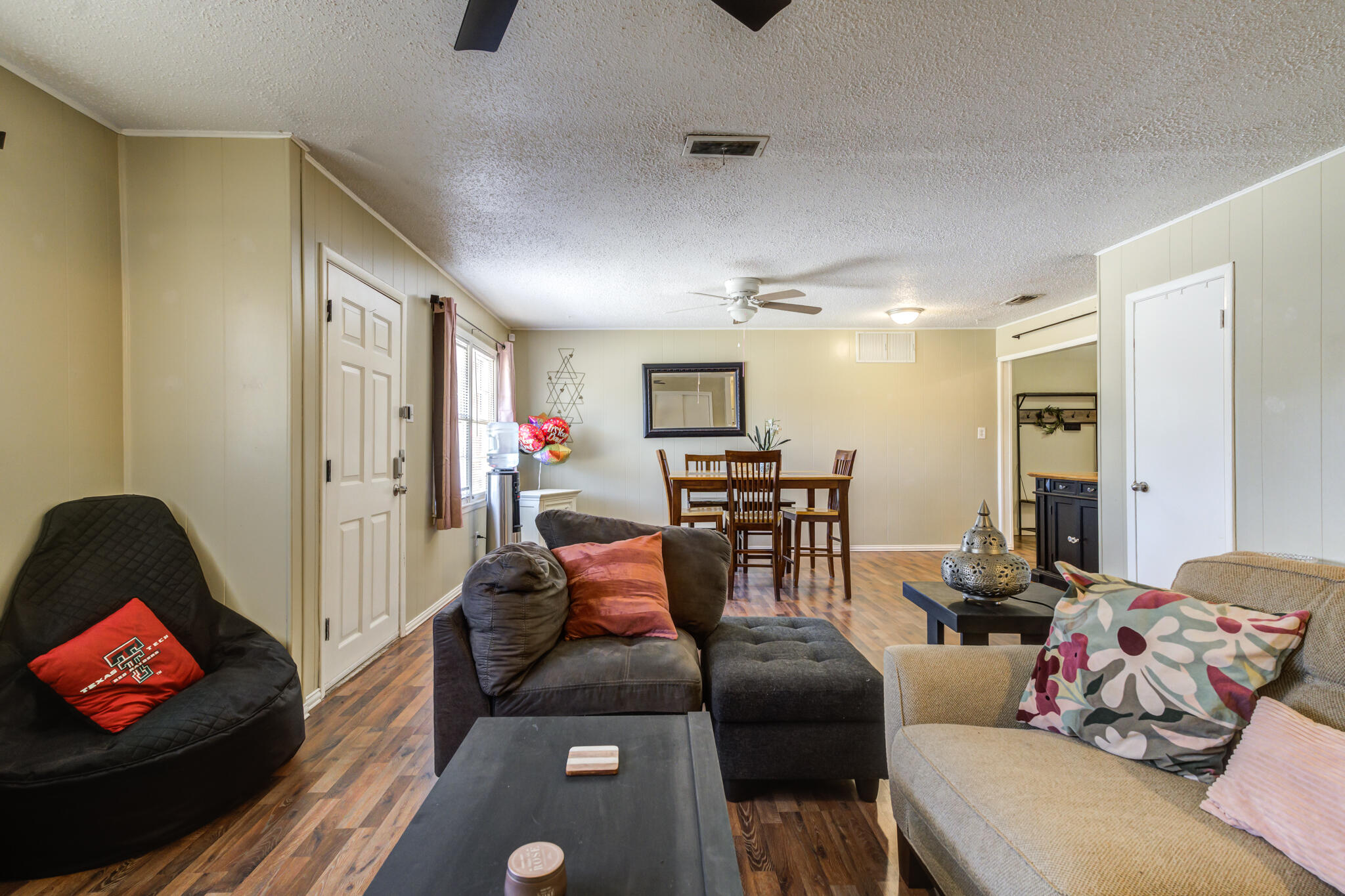 2812 62nd Street Lubbock, TX 79413 - Photo 4 of 45 a living room with furniture and wooden floor