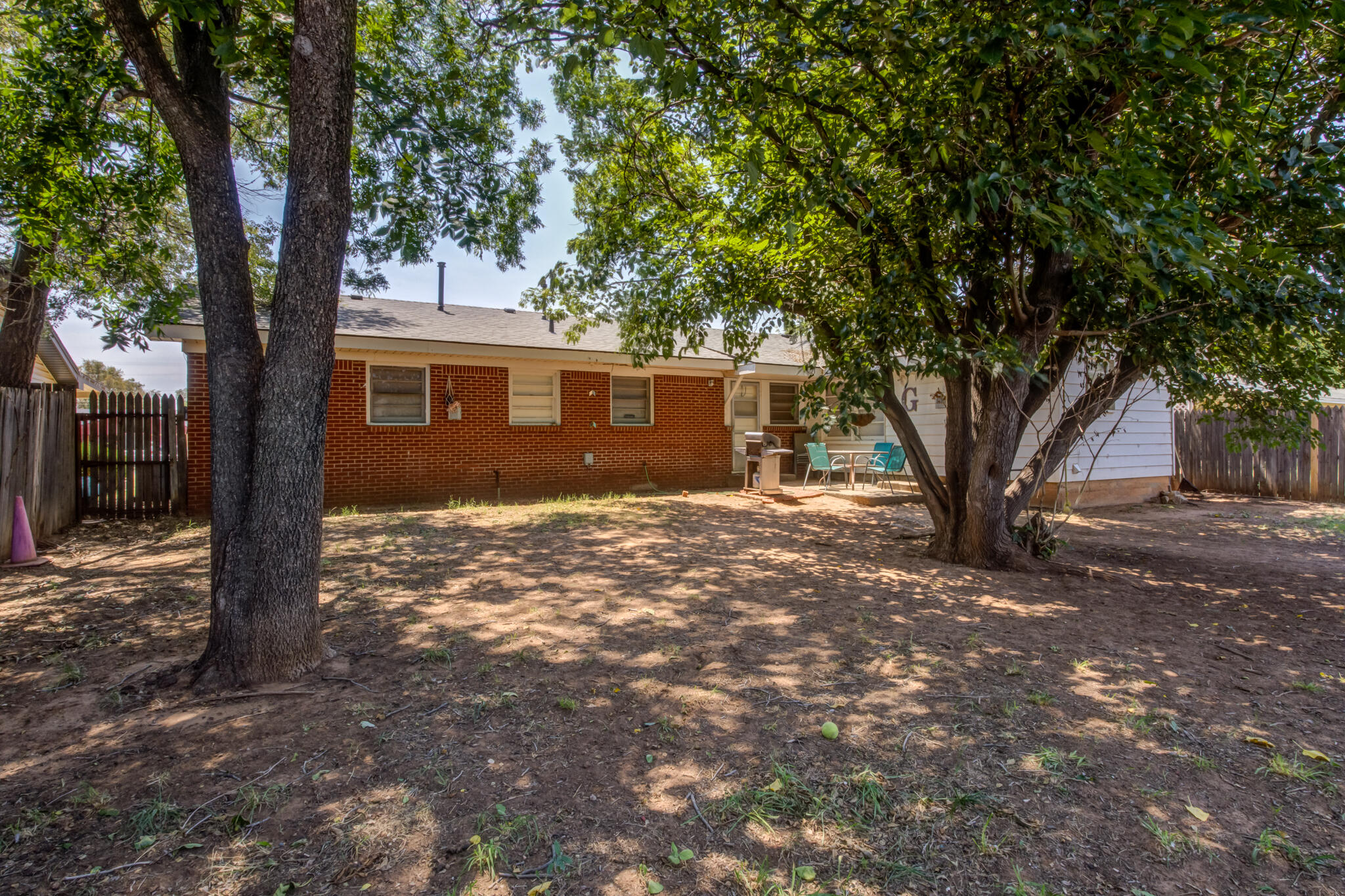 2812 62nd Street Lubbock, TX 79413 - Photo 43 of 45 a view of a house with a tree in the forest