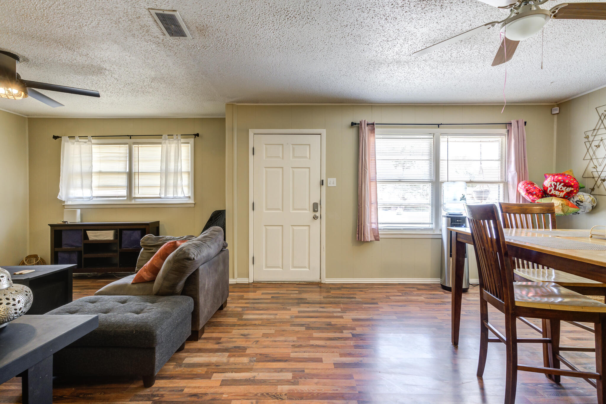 2812 62nd Street Lubbock, TX 79413 - Photo 8 of 45 a living room with furniture and a window