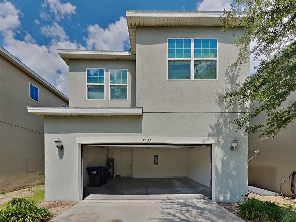 8326 Bryce Canyon Avenue Windermere, FL 34786 - Photo 1 of 20 a front view of a house with garage