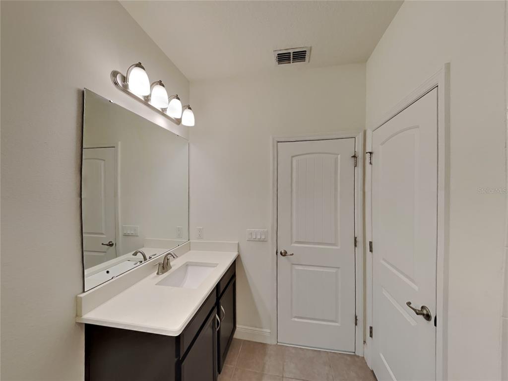 8326 Bryce Canyon Avenue Windermere, FL 34786 - Photo 11 of 20 a bathroom with a sink double vanity and a mirror