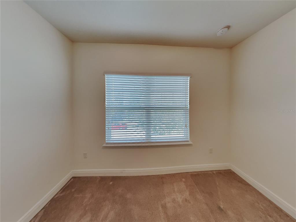 8326 Bryce Canyon Avenue Windermere, FL 34786 - Photo 14 of 20 an empty room with a window