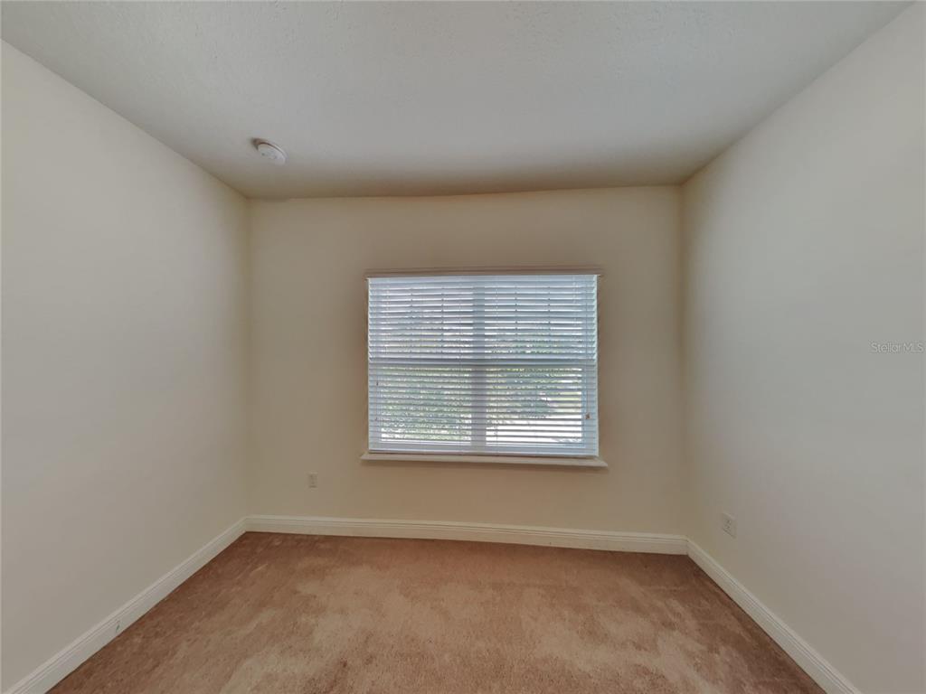 8326 Bryce Canyon Avenue Windermere, FL 34786 - Photo 16 of 20 an empty room with a window