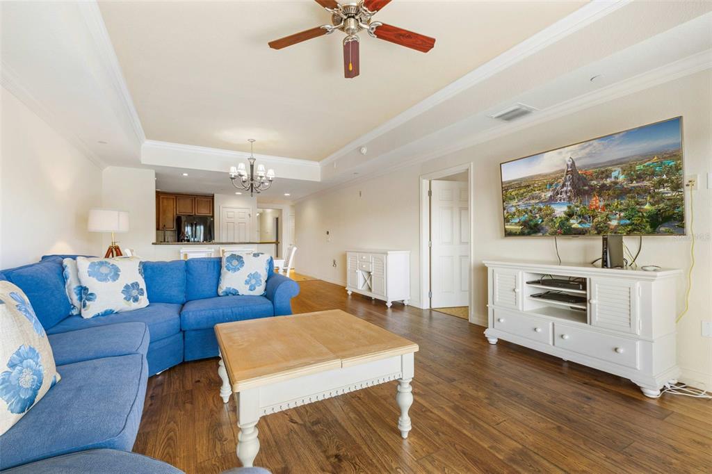 7612 Cabana Court, Unit 303 Reunion, FL 34747 - Photo 16 of 23 a living room with furniture and a flat screen tv