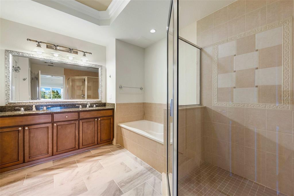 7612 Cabana Court, Unit 303 Reunion, FL 34747 - Photo 20 of 23 a spacious bathroom with a tub sink and mirror