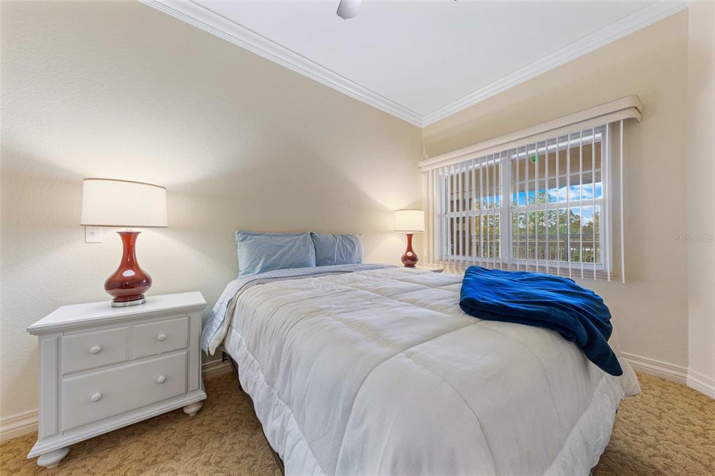 7612 Cabana Court, Unit 303 Reunion, FL 34747 - Photo 2 of 23 a bedroom with bed and window
