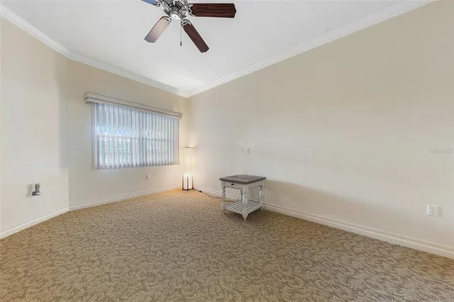 a view of an empty room and a window