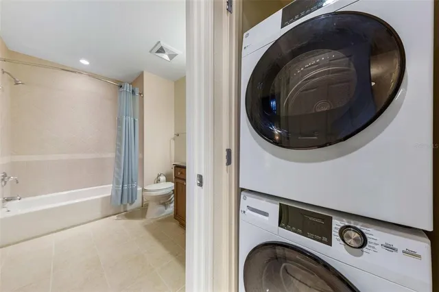 a view of a hallway with washer and dryer