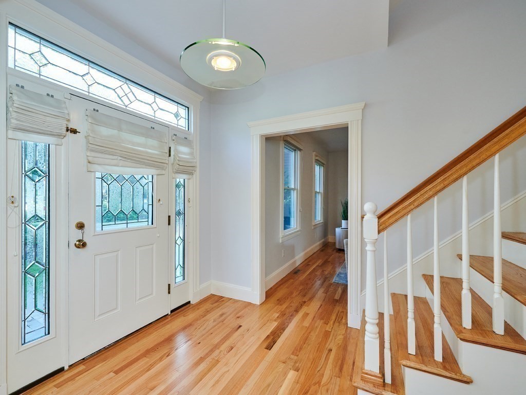 20 Garland Road Newton, MA 02459 - Photo 15 of 41 a view of a hallway with wooden floor and staircase