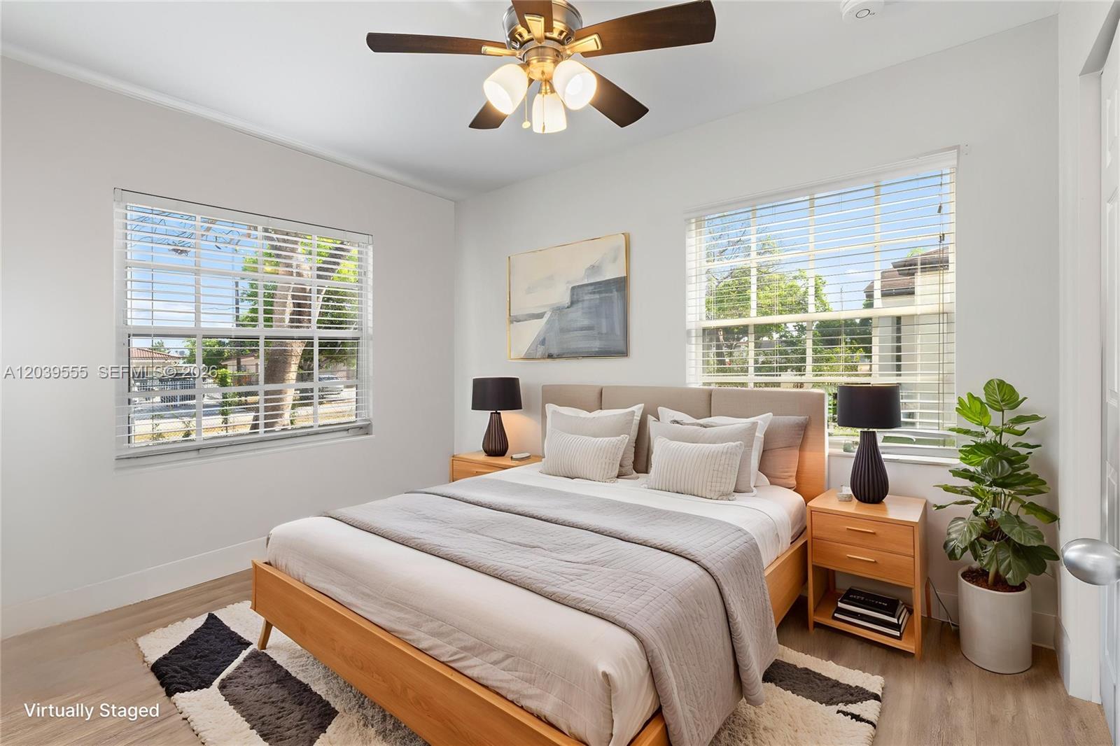 10544 Southwest 182nd Street Miami, FL 33157 - Photo 10 of 15 a bedroom with a bed and a potted plant