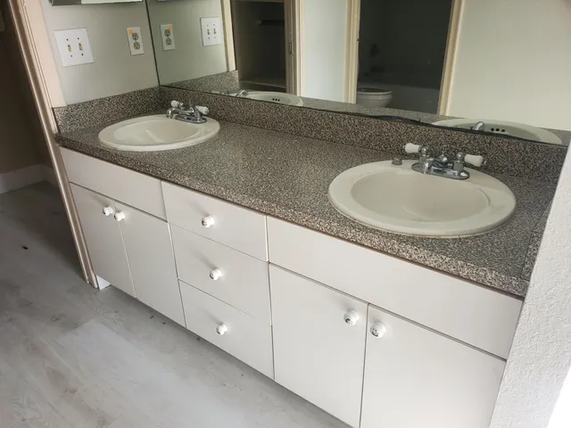 a bathroom with a sink and a mirror