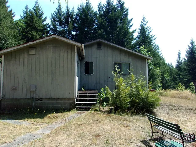 a backyard of a house with lots of green space