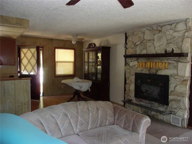 a bedroom with furniture and a fireplace
