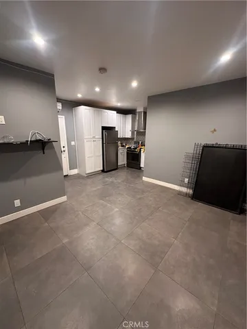 a view of a room with a refrigerator