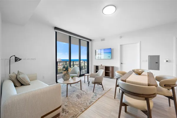 a living room with furniture and a window