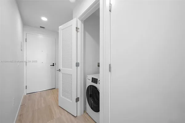 a view of a utility room with washer and dryer