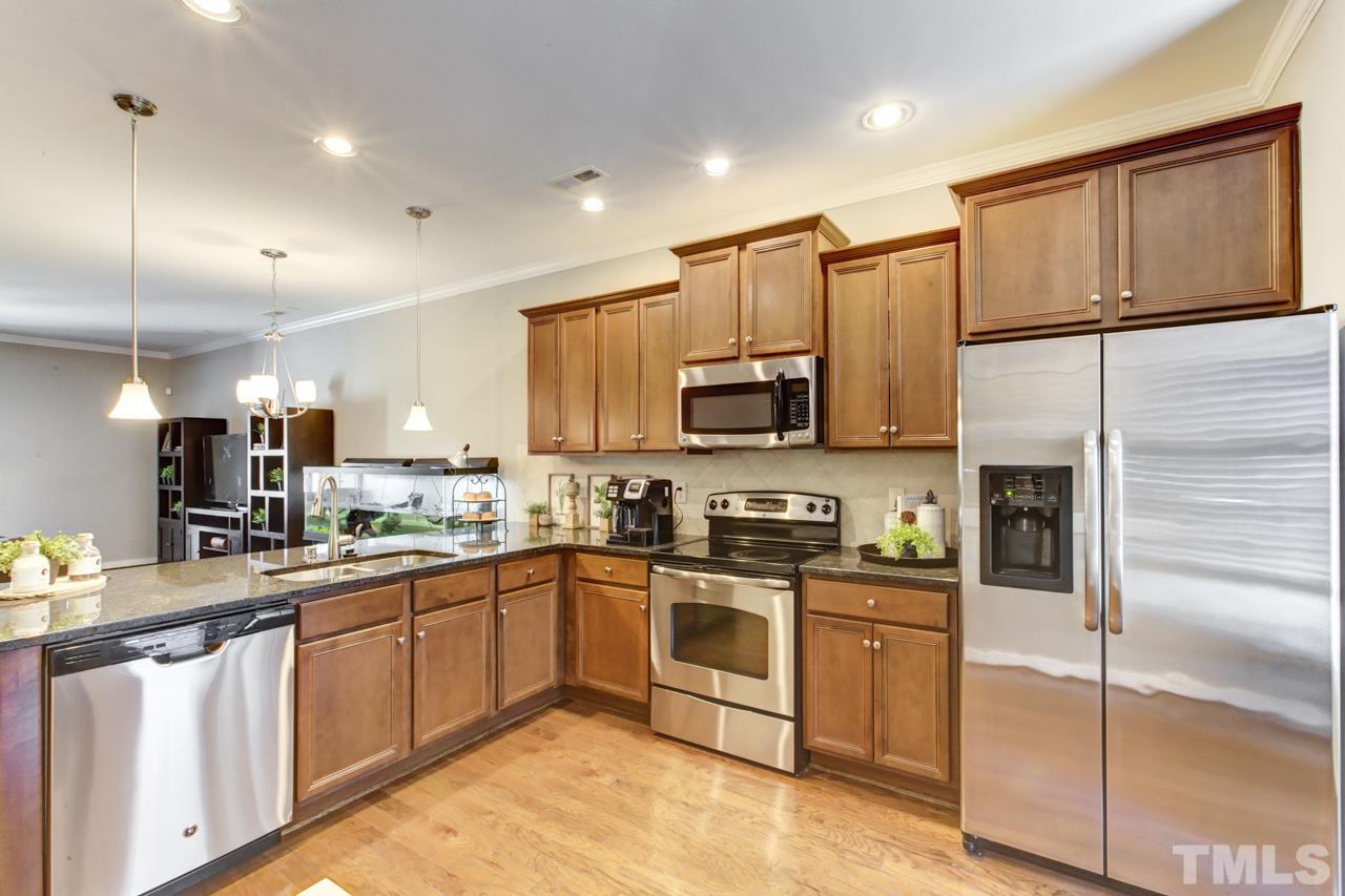 7831 Allscott Way Raleigh, NC 27612 - Photo 1 of 7 The open kitchen offers GRANITE counters, STAINLESS STEEL appliances, breakfast nook, and a PANTRY.