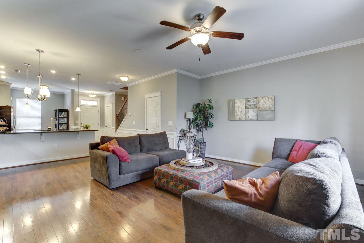7831 Allscott Way Raleigh, NC 27612 - Photo 3 of 7 The family room is OPEN to both the kitchen and breakfast/dining area for ease in entertaining. Enjoy the PRIVATE PATIO for grilling out with access from the family room.