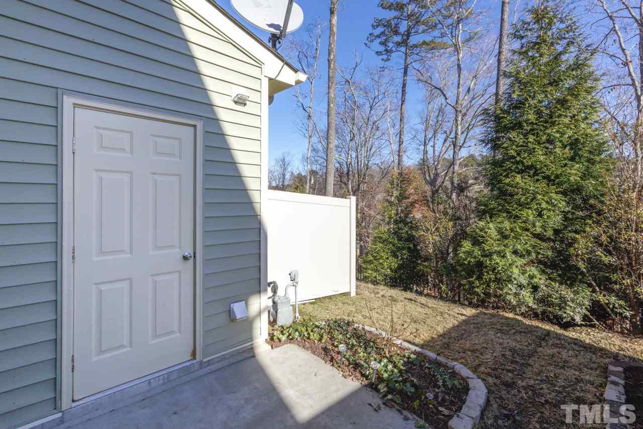 7831 Allscott Way Raleigh, NC 27612 - Photo 6 of 7 This private outdoor living space backs up to a wooded area offers extra storage and a grilling PATIO for backyard BBQs!