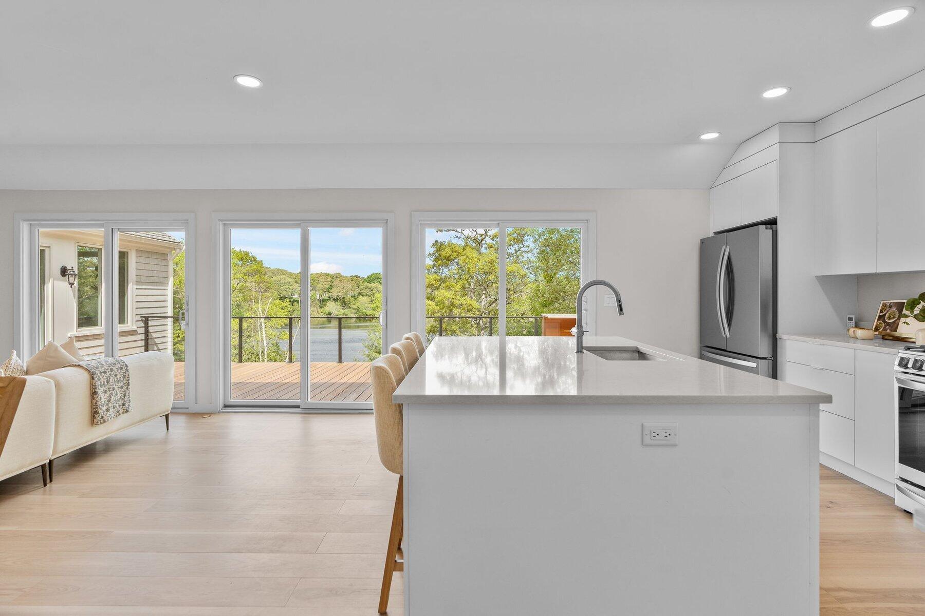 162 Main Street Osterville, MA 02655 - Photo 17 of 50 a living room with furniture and a large window