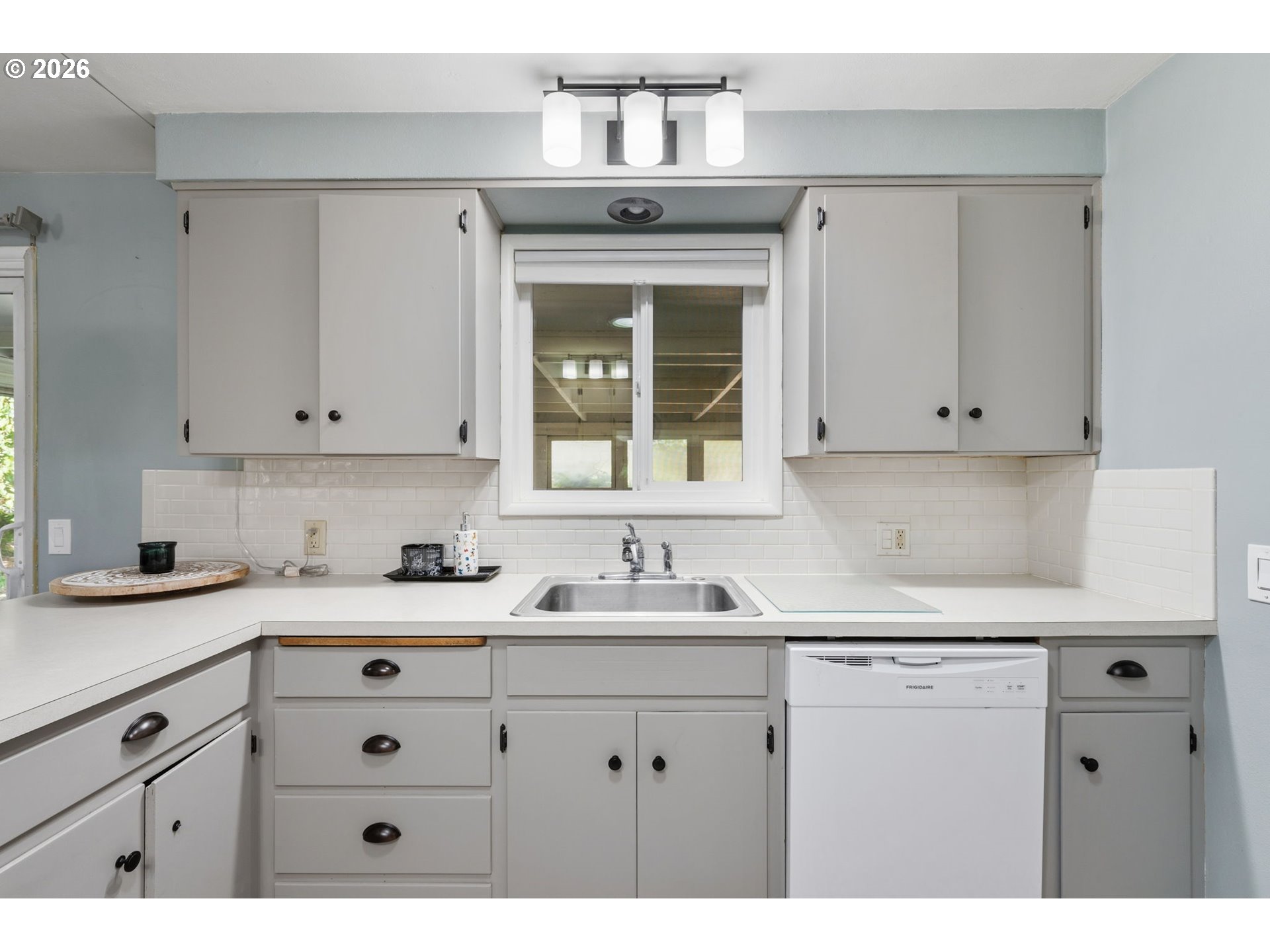 2936 Game Farm Road Springfield, OR 97477 - Photo 11 of 25 a kitchen with cabinets appliances and a sink