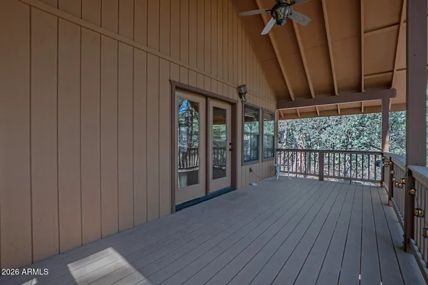 a view of porch with furniture and wooden floor