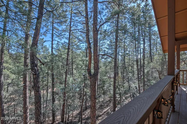 a kitchen with refrigerator and chairs