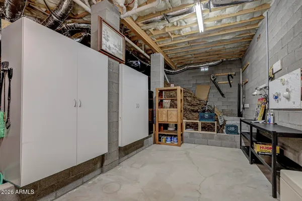 a view of a house with a yard and large tree