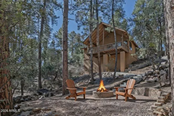 a view of a building with sitting area and covered with snow