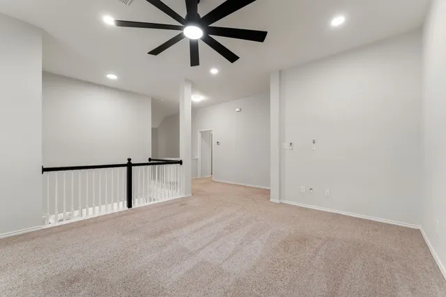 a spacious bedroom with a bed and a couch