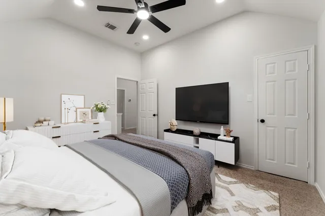 a white bath tub sitting next to a white toilet and sink