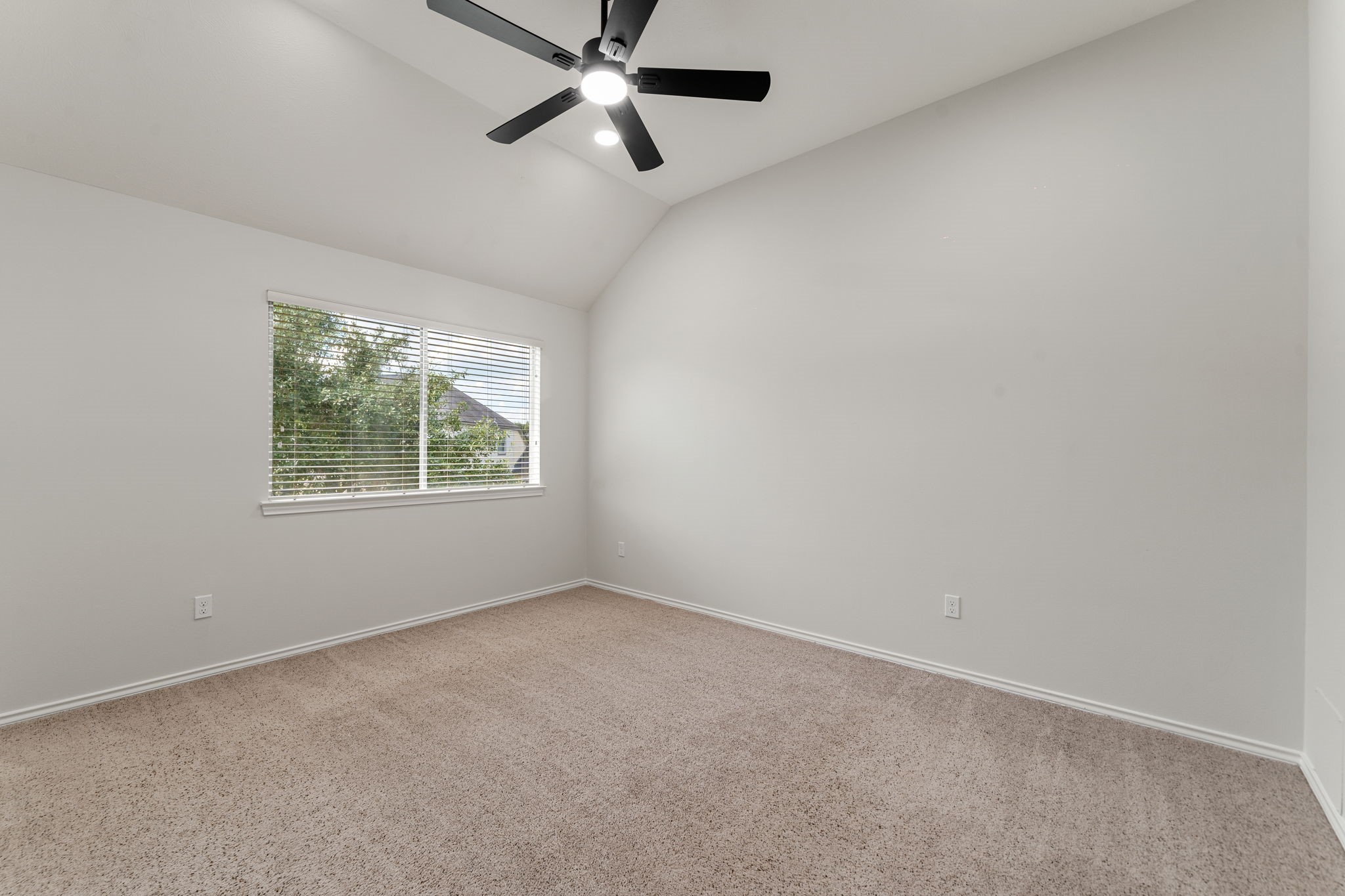 22 Crestview Trail Houston, TX 77082 - Photo 28 of 39 an empty room with a window and a fan