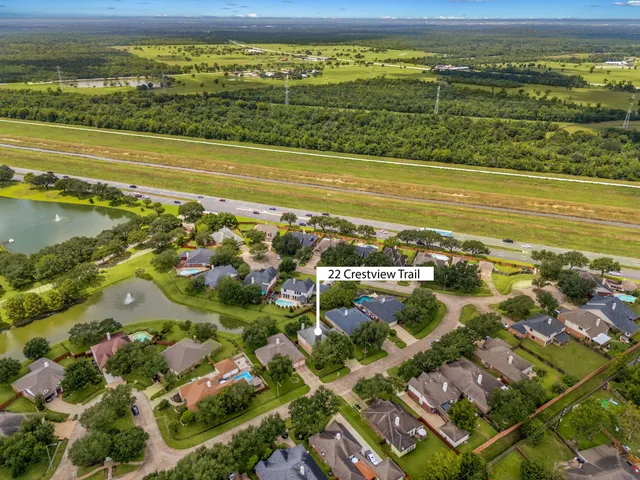 an aerial view of a house with outdoor space pool patio and lake view