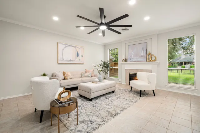 a living room with furniture and a fireplace