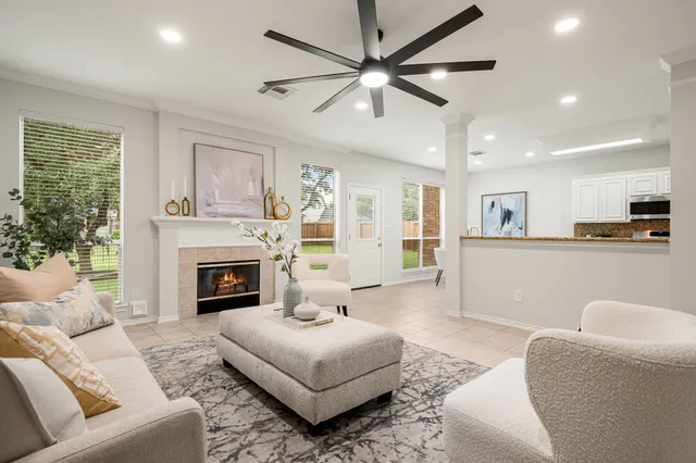 a living room with furniture and a fireplace