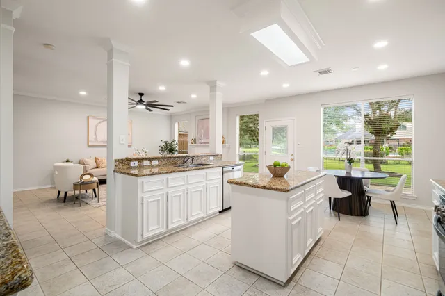 a kitchen with stainless steel appliances granite countertop a stove and a sink