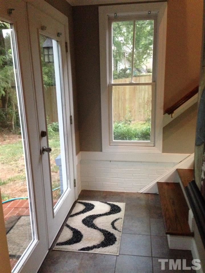 309 Avon Drive Raleigh, NC 27608 - Photo 15 of 17 a bathroom with a bathtub and a window
