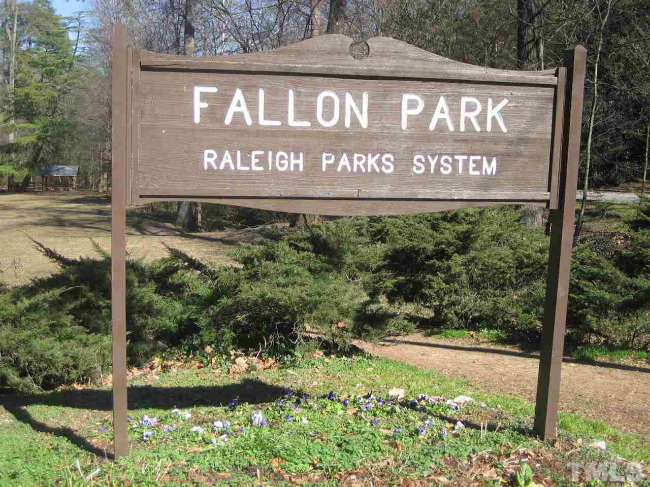 309 Avon Drive Raleigh, NC 27608 - Photo 4 of 17 a sign broad in front of red brick house