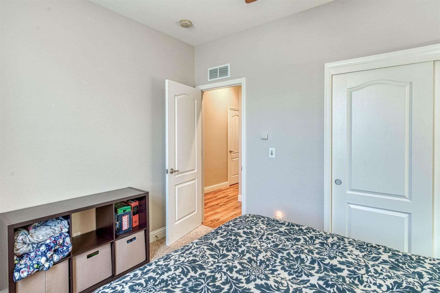 3754 Salem Lane Clovis, CA 93619 - Photo 11 of 18 a bedroom with a bed and cabinets