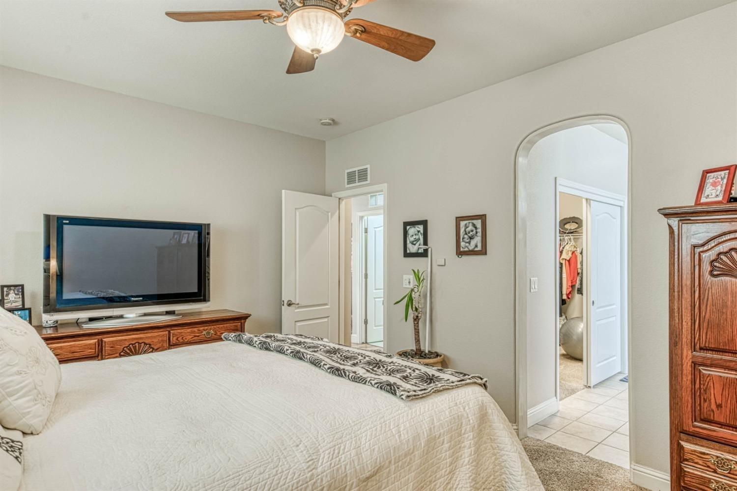 3754 Salem Lane Clovis, CA 93619 - Photo 12 of 18 a bedroom with bed and flat screen tv