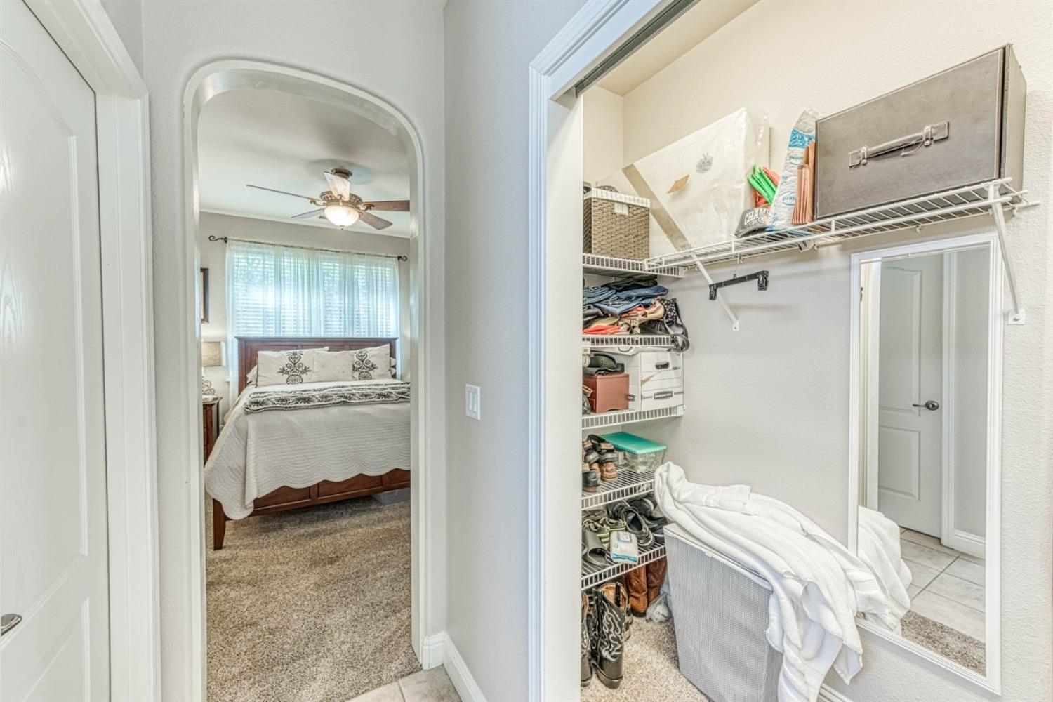 3754 Salem Lane Clovis, CA 93619 - Photo 9 of 18 a view of a bedroom with a bed and a window