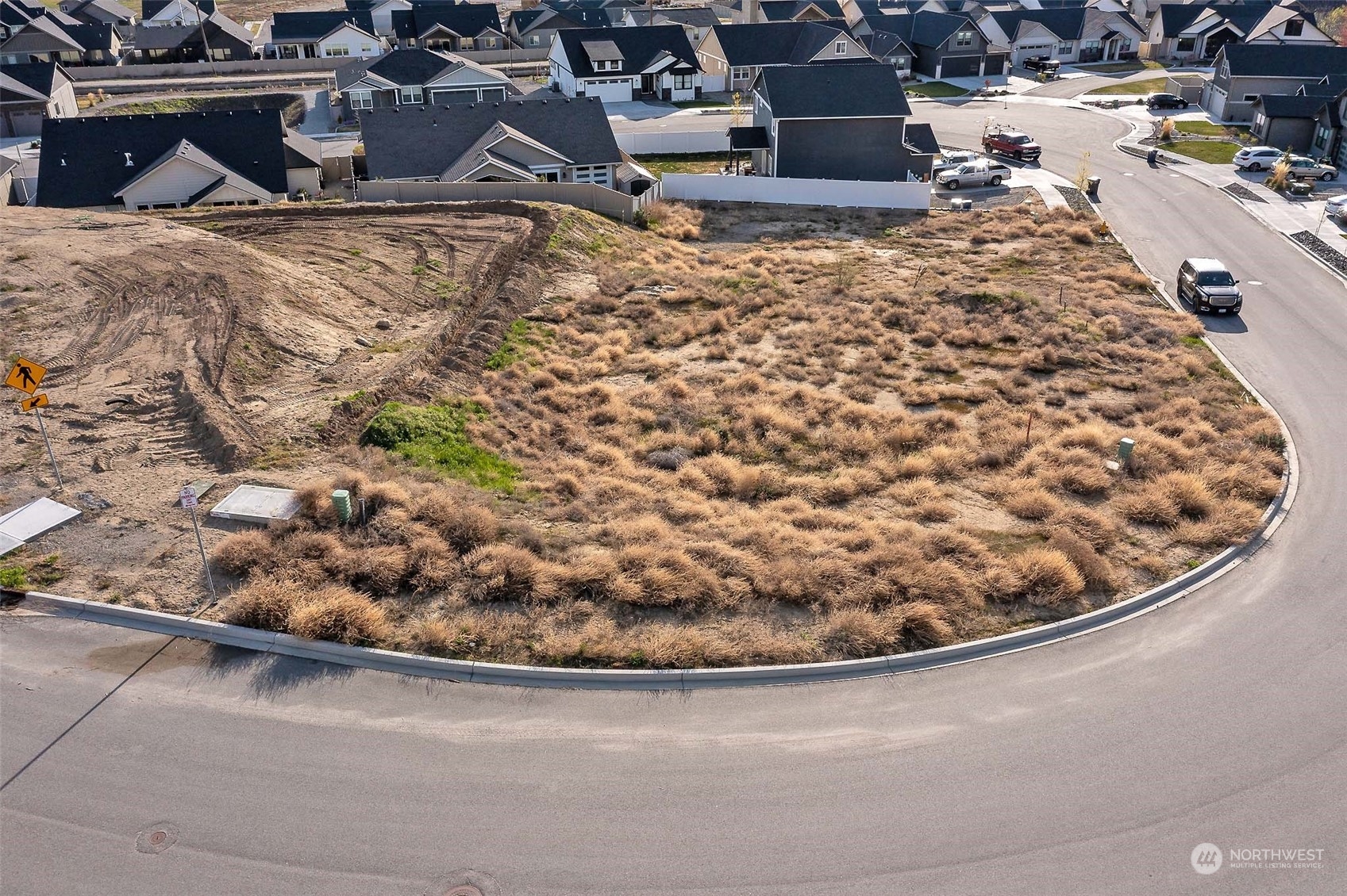 982 Spring Mountain Drive Wenatchee, WA 98801 - Photo 5 of 6 a view of a house with a yard