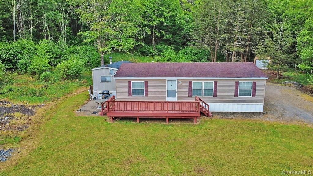 308 William Brown Road Fremont, NY 12741 - Photo 12 of 33 a front view of a house with a garden and swimming pool