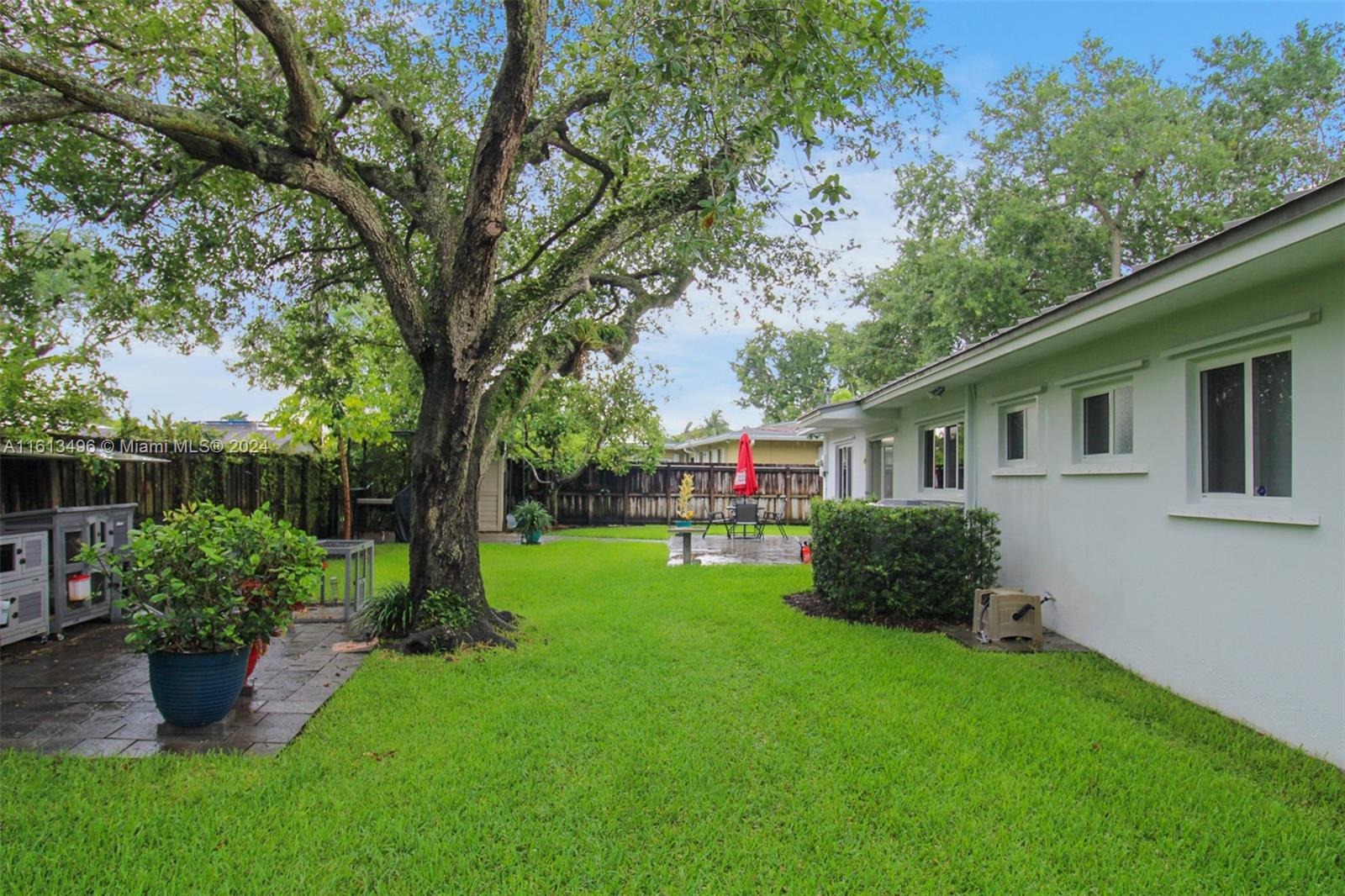 9730 Southwest 76th Street Miami, FL 33173 - Photo 15 of 27 a front view of a house with garden