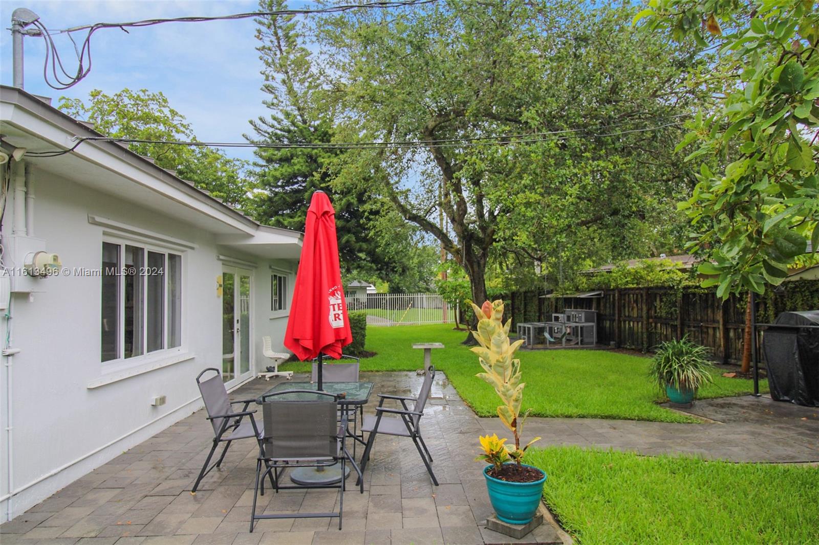 9730 Southwest 76th Street Miami, FL 33173 - Photo 17 of 27 a view of a backyard with sitting area and garden