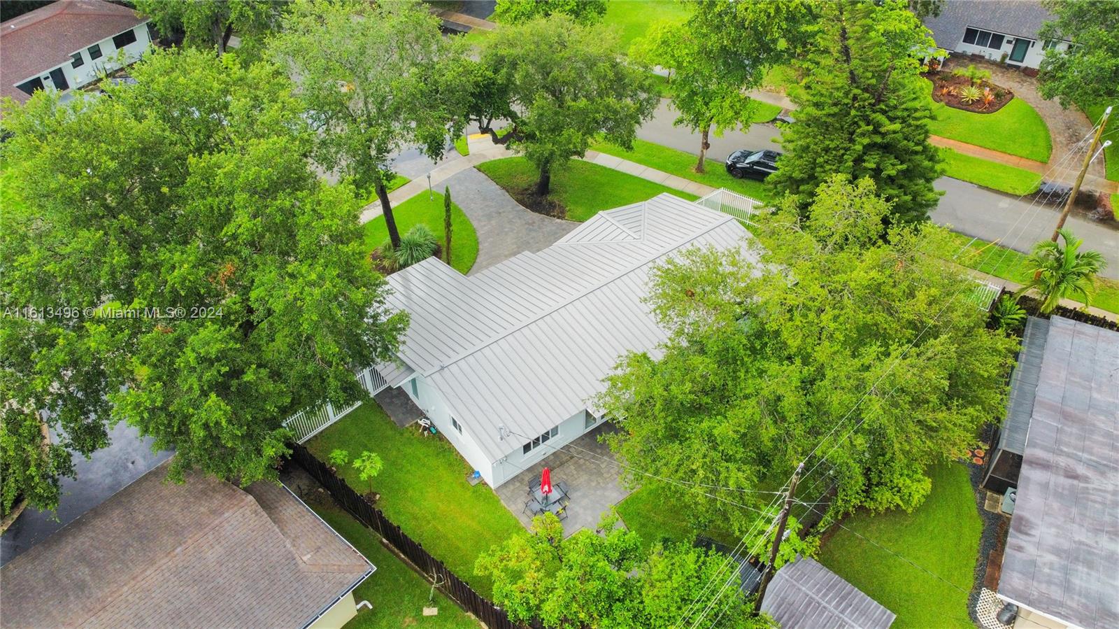 9730 Southwest 76th Street Miami, FL 33173 - Photo 27 of 27 an aerial view of a house with a yard and outdoor seating